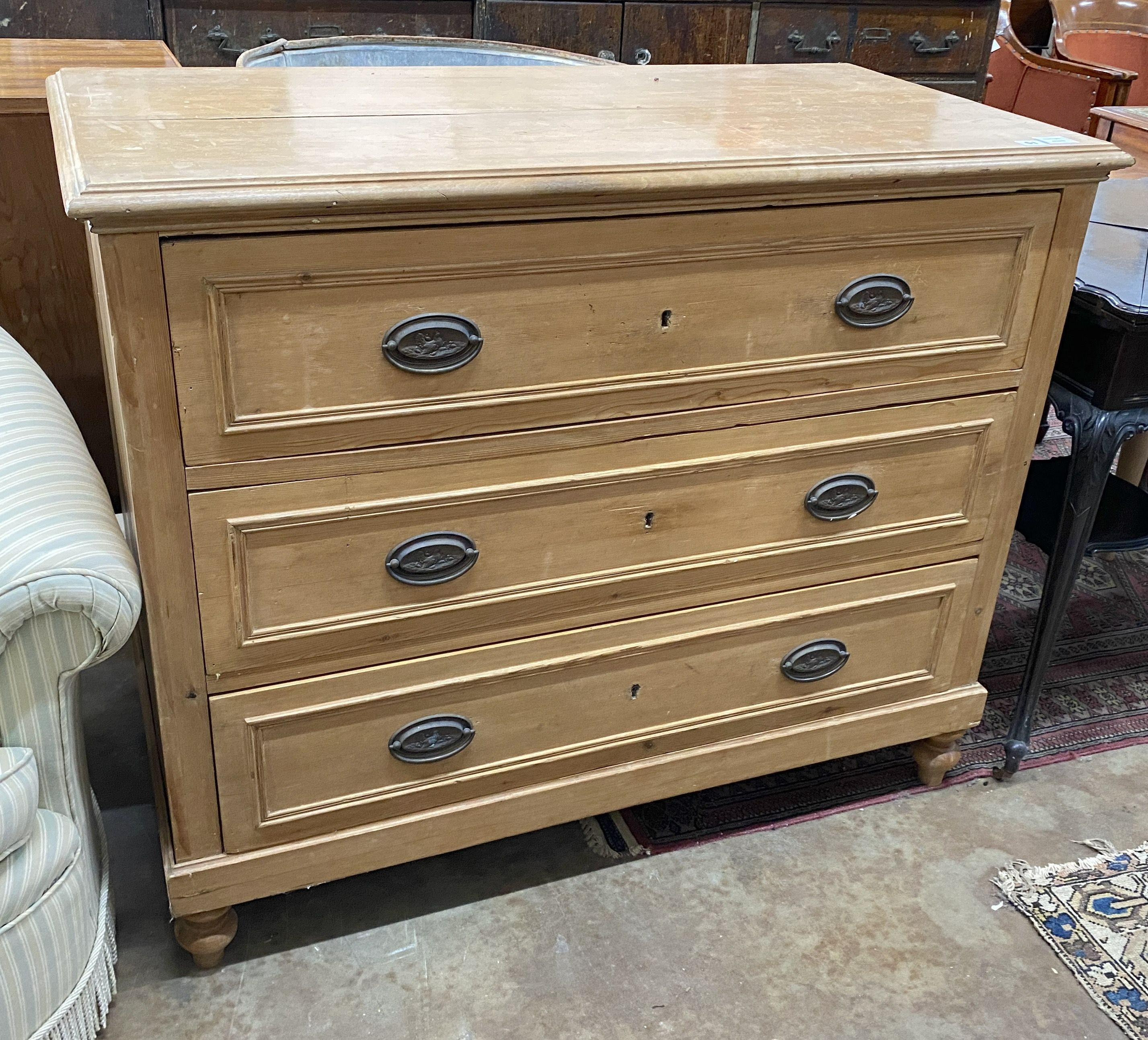 A 19th century east European pine three drawer chest, width 110cm, depth 56cm, height 93cm